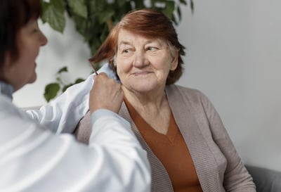 close-up-nurse-brushing-woman-hair