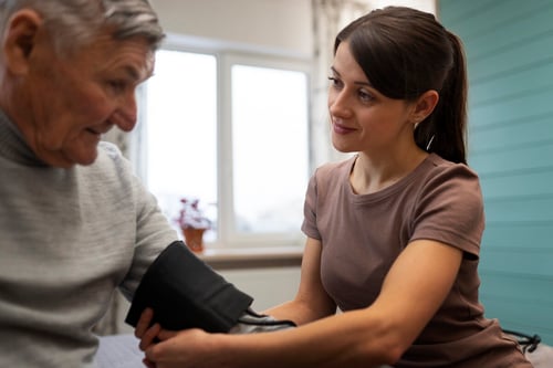 elderly-person-being-taken-care-by-female-caretaker-2