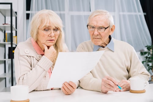 senior-couple-doing-paperwork