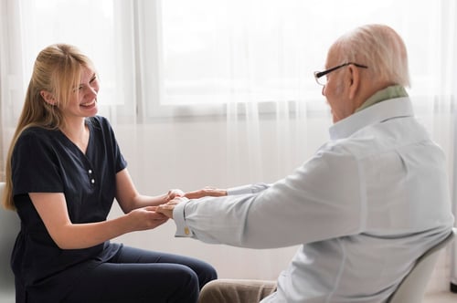 side-view-nurse-holding-senior-man-s-hands